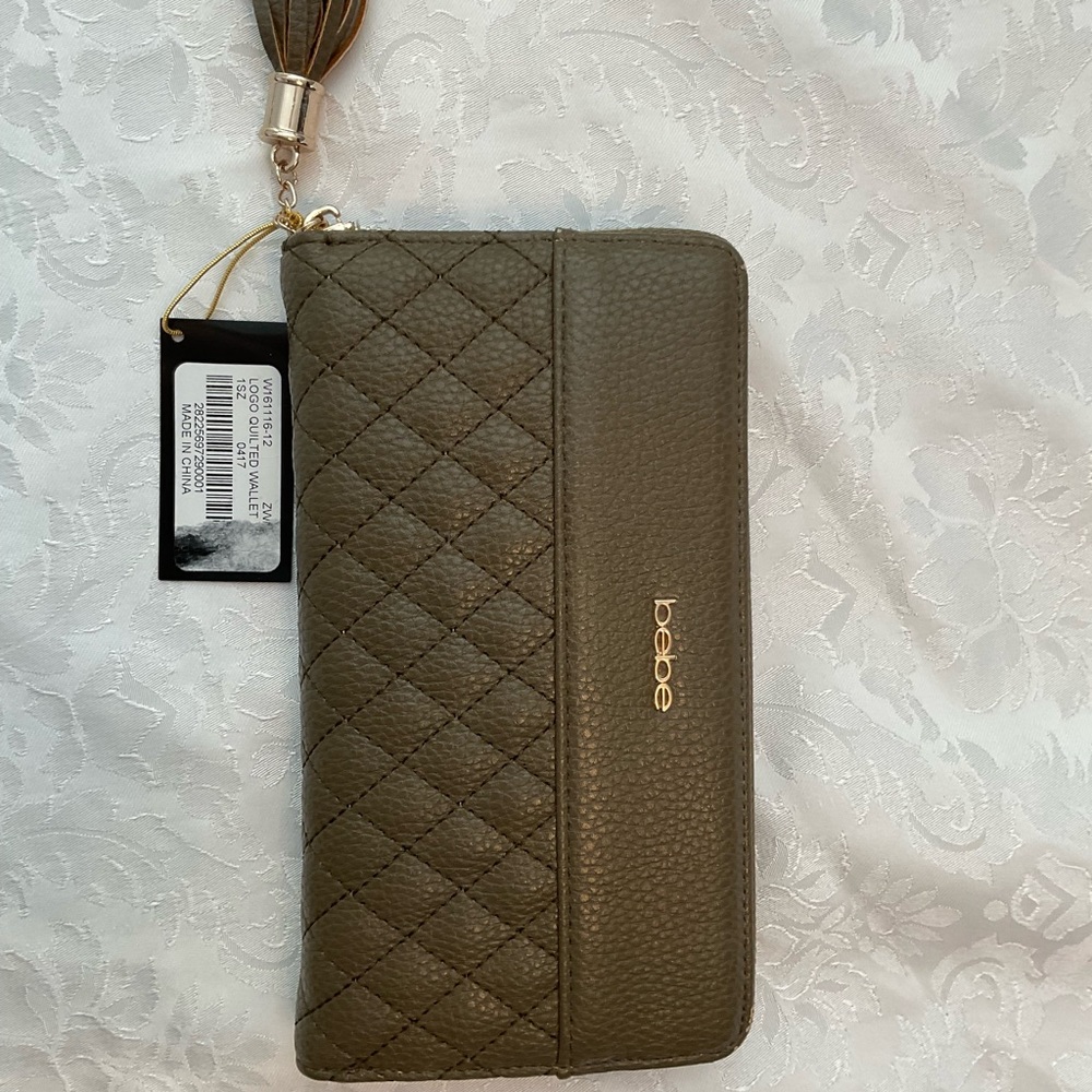 Bebe The Evelyn wallet has a crocodile PU material
